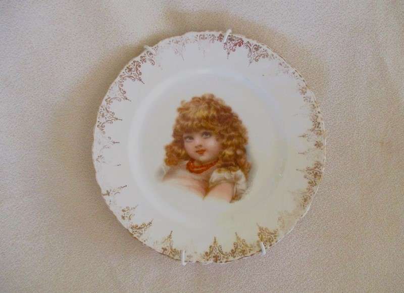 2. Two vintage porcelain display plates of two Victorian young girls -  with hangers