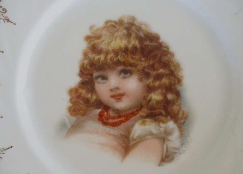 2. Two vintage porcelain display plates of two Victorian young girls -  with hangers