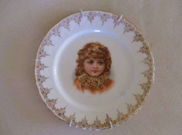 2. Two vintage porcelain display plates of two Victorian young girls -  with hangers