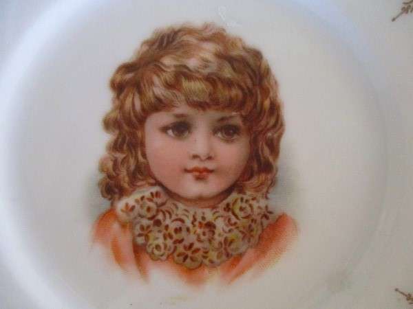 2. Two vintage porcelain display plates of two Victorian young girls -  with hangers