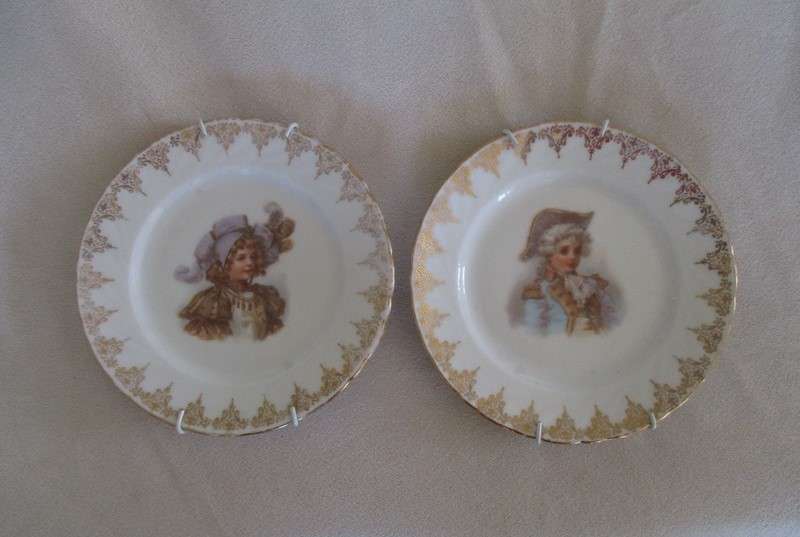 1. Two vintage porcelain display plates of two Victorian young ladies - with hangers