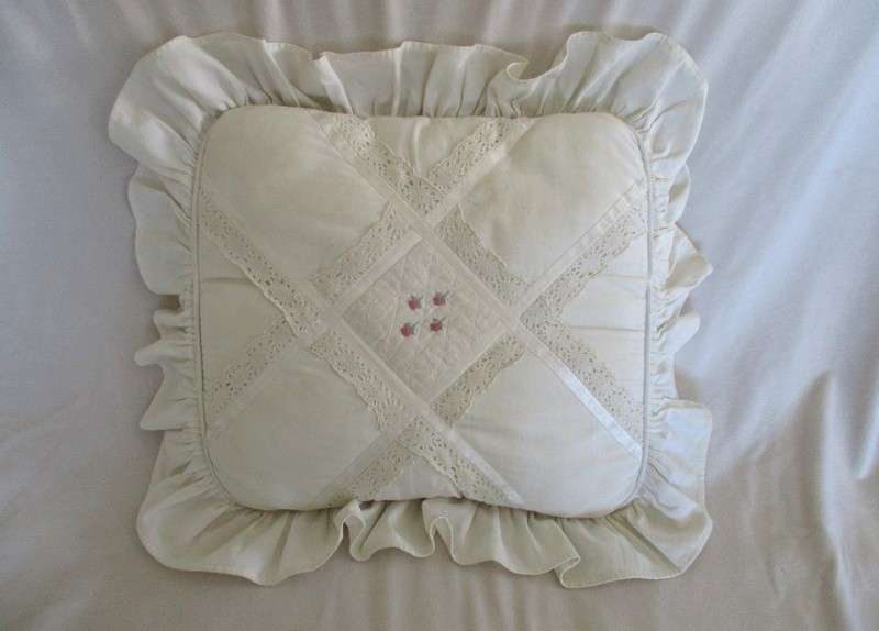 A pretty cushion with lace and ribbon detail