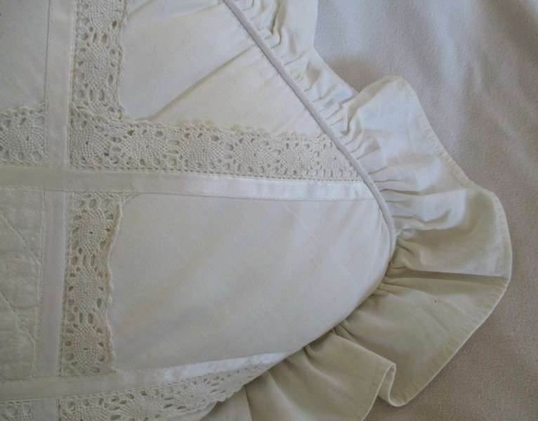 A pretty cushion with lace and ribbon detail