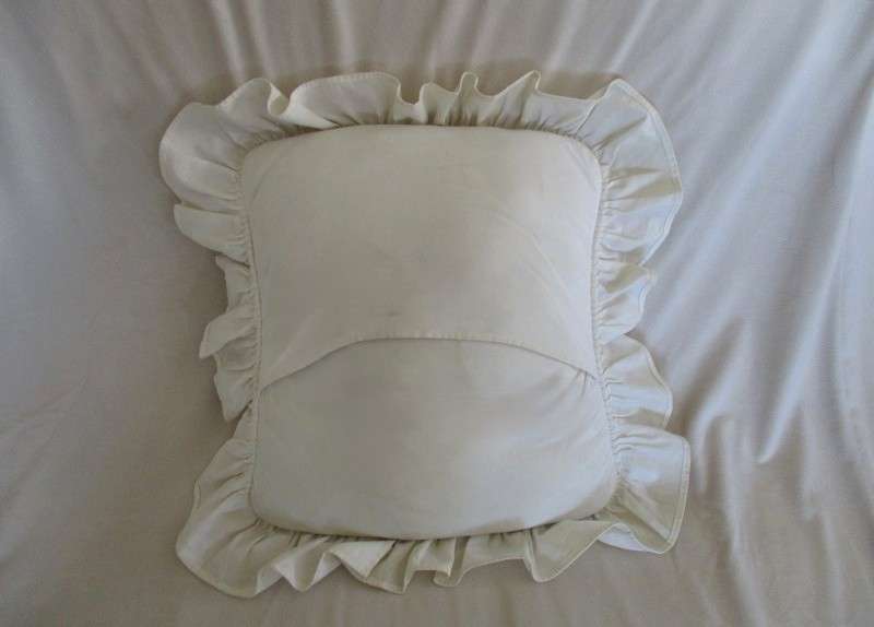 A pretty cushion with lace and ribbon detail