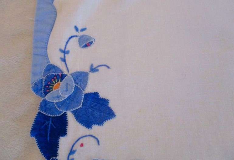 Two rectangular and one square vintage appliqued and embroidered cloths with beautiful water lilies