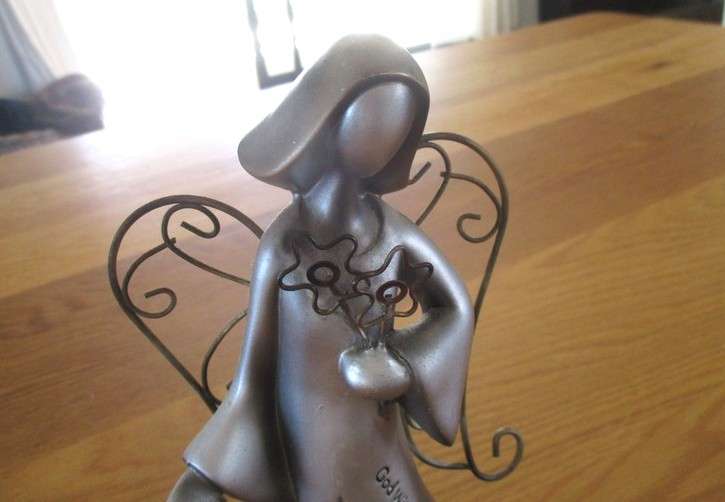 A silver tone metal angel
