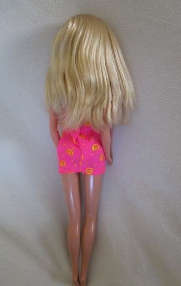 Pretty Mattel Barbie doll with bangs and original earrings and dress  - knees that bend
