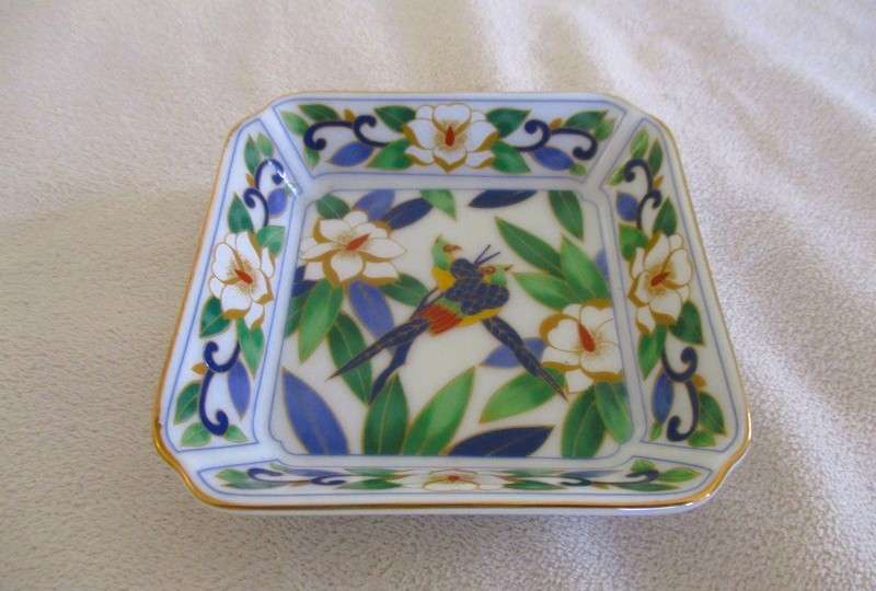 A Chinese porcelain pin dish with bird and floral design - signed