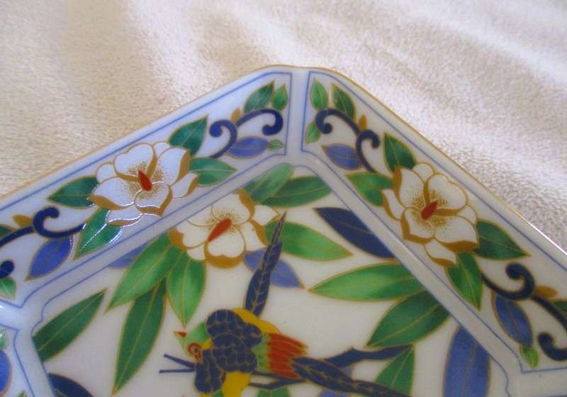 A Chinese porcelain pin dish with bird and floral design - signed