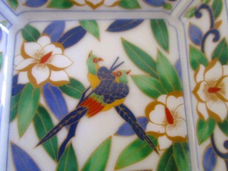 A Chinese porcelain pin dish with bird and floral design - signed