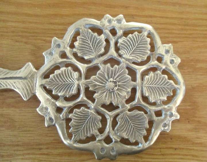 For Regina only - A heavy vintage solid brass trivet/pot stand with ornate floral and foliage design