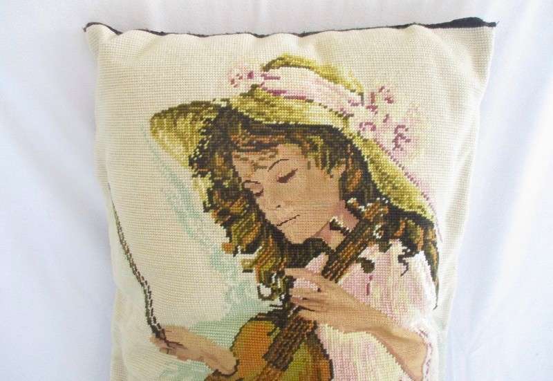 A large hand made cushion combining Petit Point and ordinary tapestry - girl playing violin