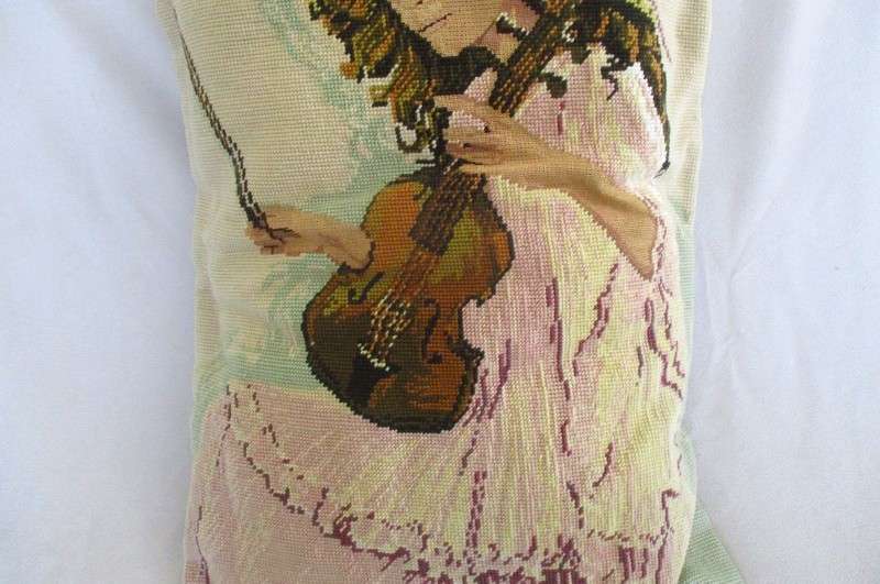 A large hand made cushion combining Petit Point and ordinary tapestry - girl playing violin