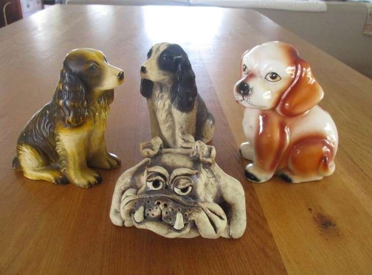 Batch of four antique and vintage dogs