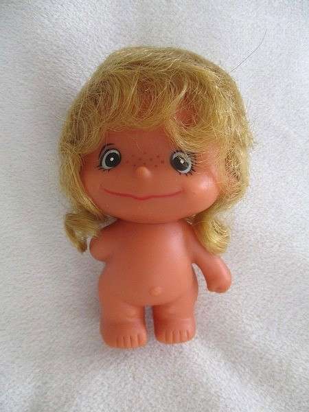 A touching story to read .... Small vintage  "Love is" doll