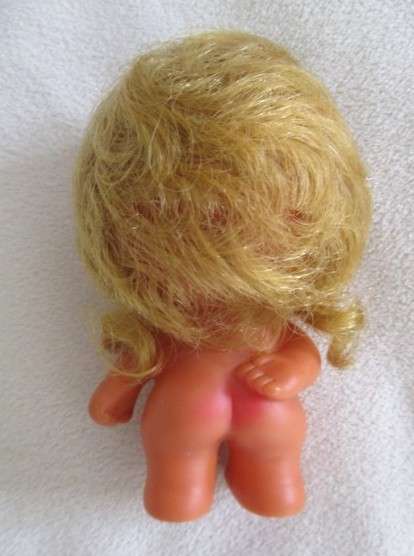A touching story to read .... Small vintage  "Love is" doll