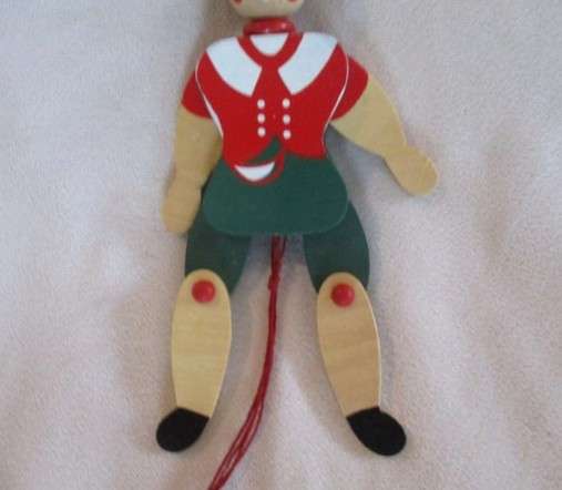 Two cute vintage wooden Pinocchios