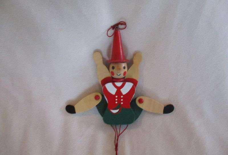 Two cute vintage wooden Pinocchios