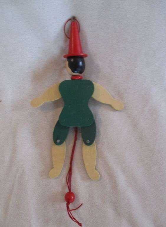 Two cute vintage wooden Pinocchios
