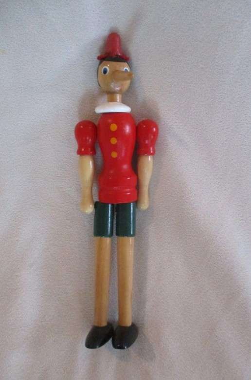 Two cute vintage wooden Pinocchios