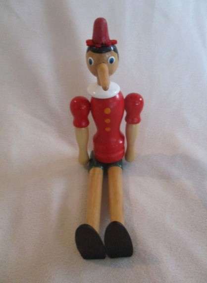 Two cute vintage wooden Pinocchios