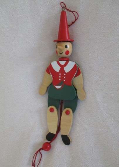 Two cute vintage wooden Pinocchios