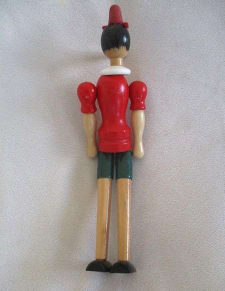 Two cute vintage wooden Pinocchios
