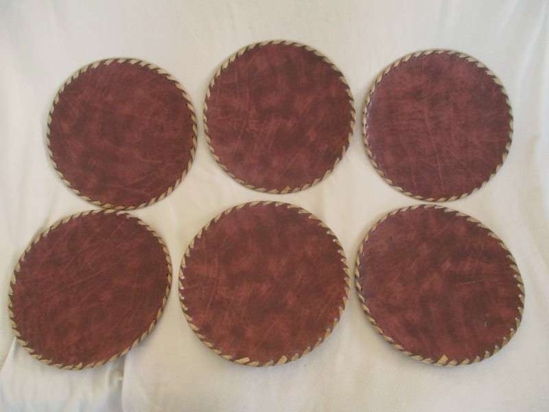Vintage and very unique - hand crafted real leather mats of various Kenyan tribes