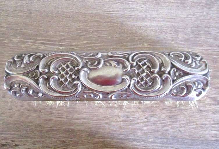 Two antique Victorian Art Nouveau repousse silver plated clothes brushes
