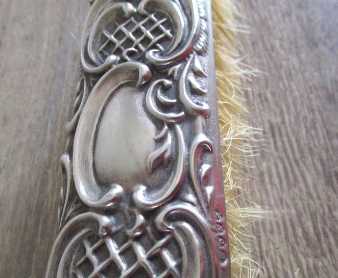 Two antique Victorian Art Nouveau repousse silver plated clothes brushes
