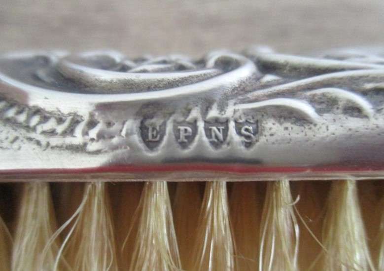 Two antique Victorian Art Nouveau repousse silver plated clothes brushes