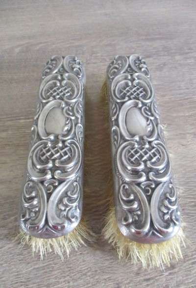 Two antique Victorian Art Nouveau repousse silver plated clothes brushes