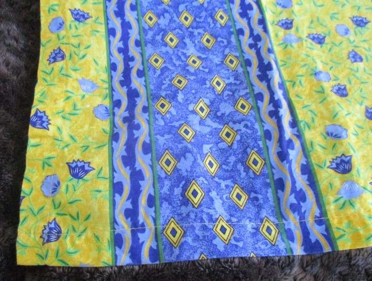 Two cheerful floral curtain drapes