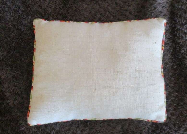 A cute small cushion for a doggy basket