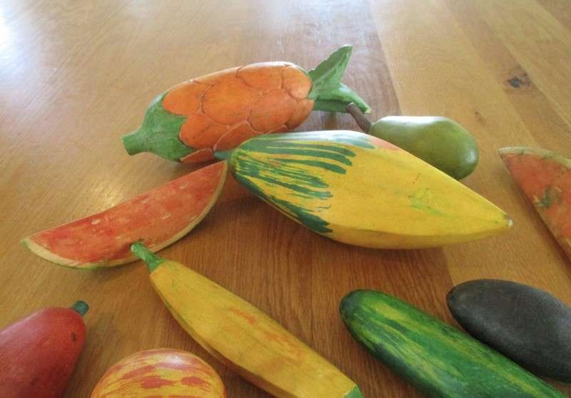 Lot of thirteen large, rustic hand painted fruit and vegetables to display in a bowl