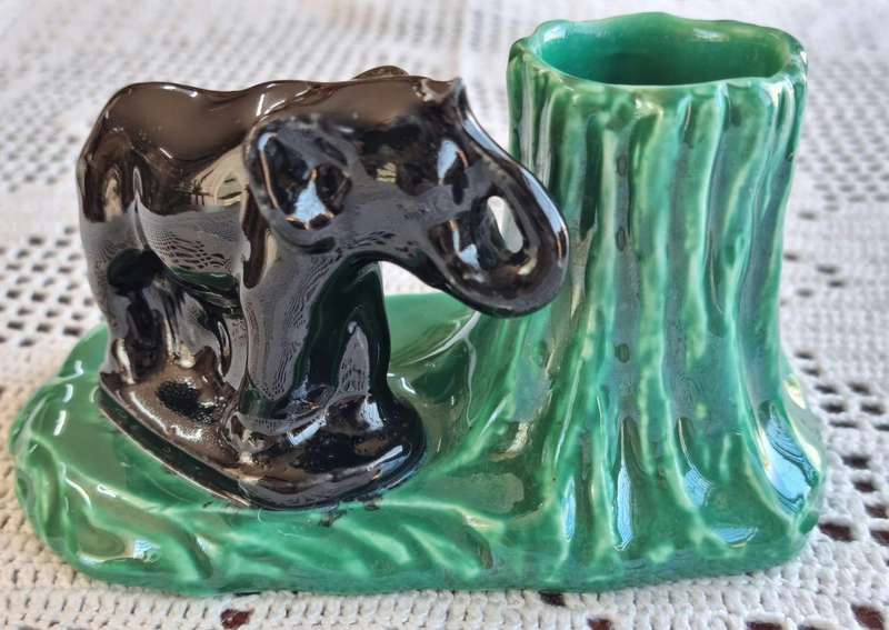 A stunning retro look Lucia ware elephant and tree trunk vase.