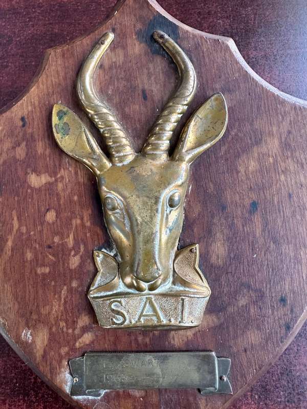SAI brass & wood plaque