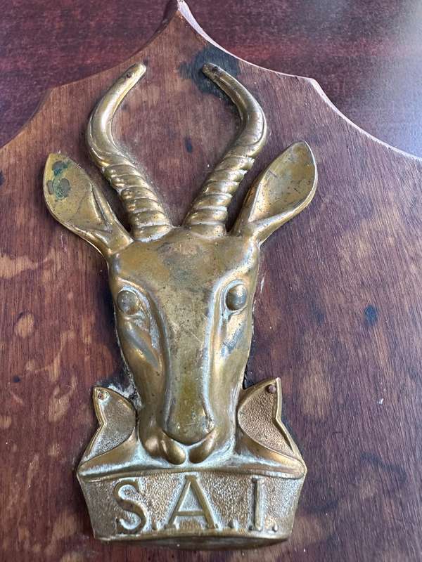 SAI brass & wood plaque