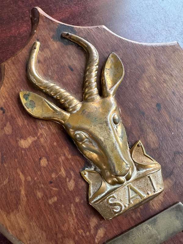 SAI brass & wood plaque