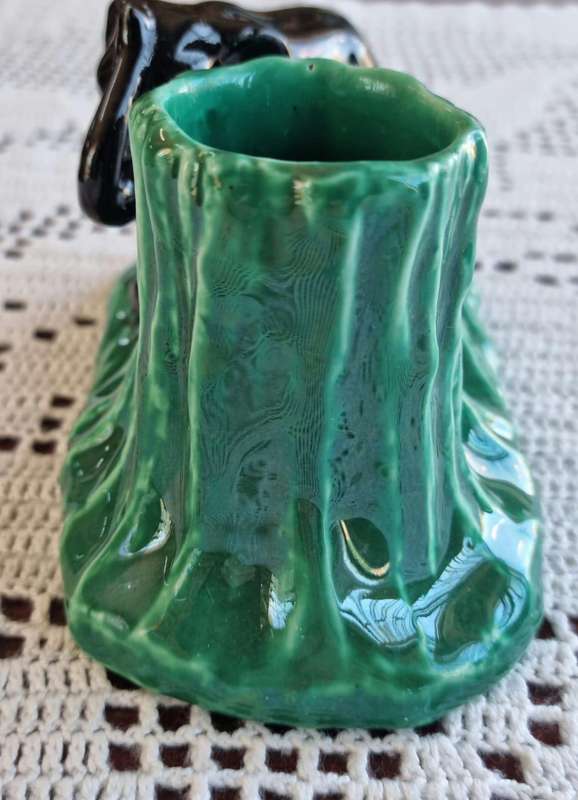 A stunning retro look Lucia ware elephant and tree trunk vase.