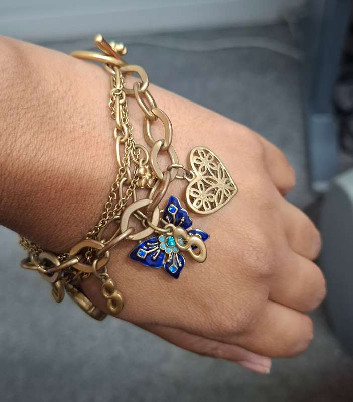 GUESS Iconic charm bracelet...over 7 stunning charms