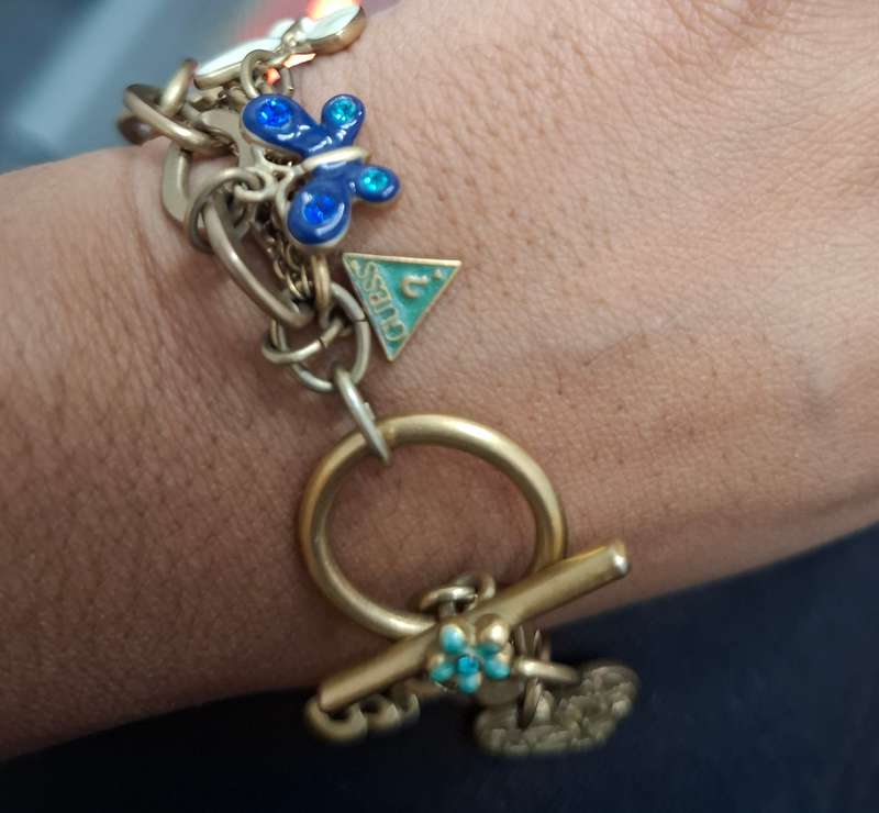 GUESS Iconic charm bracelet...over 7 stunning charms