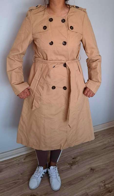 Beige double breasted trench coat