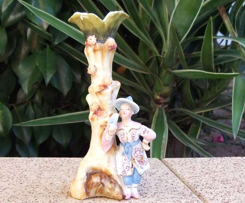 A rare Victorian era porcelain spill vase with Chinese man motif