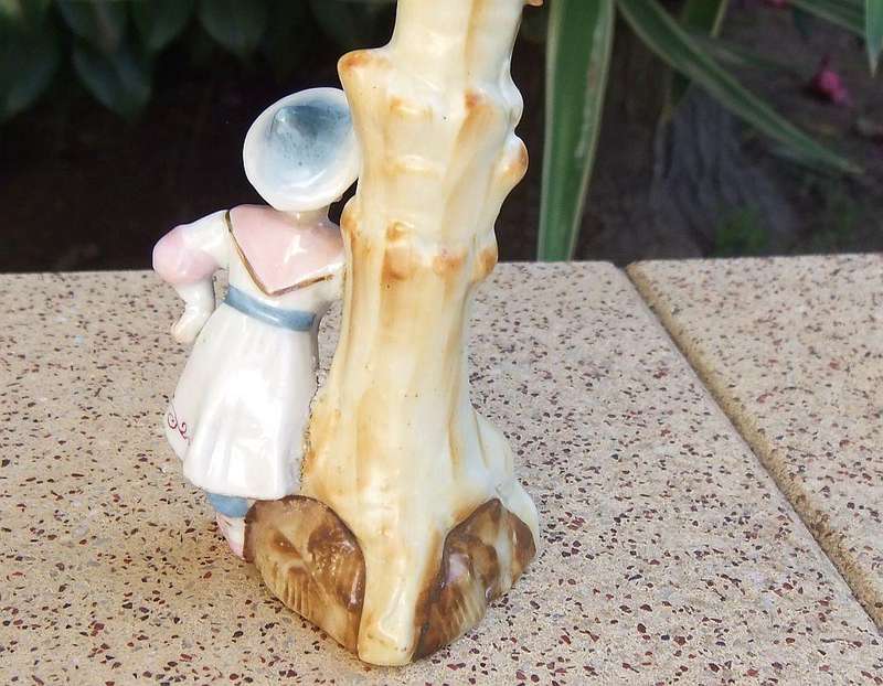 A rare Victorian era porcelain spill vase with Chinese man motif