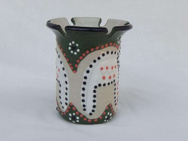 A hand made and hand painted pen holder with elephant motif dated 2001