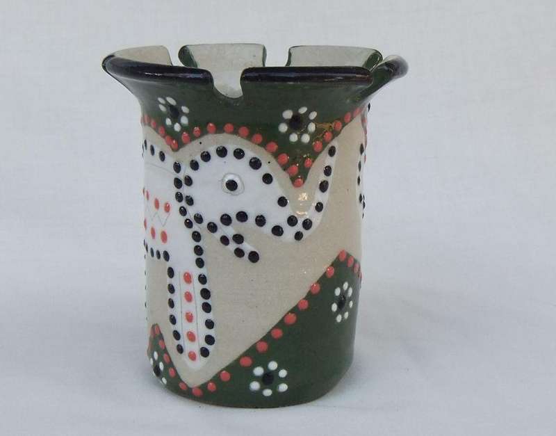 A hand made and hand painted pen holder with elephant motif dated 2001