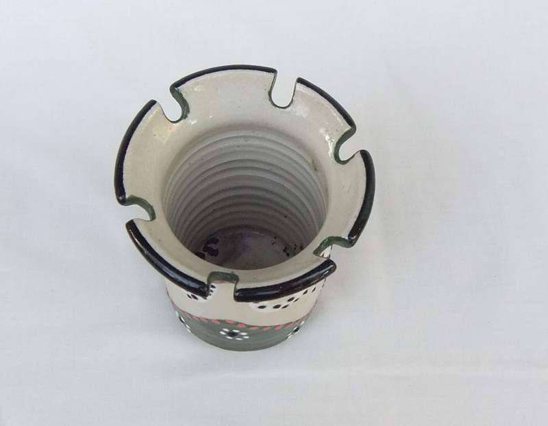 A hand made and hand painted pen holder with elephant motif dated 2001