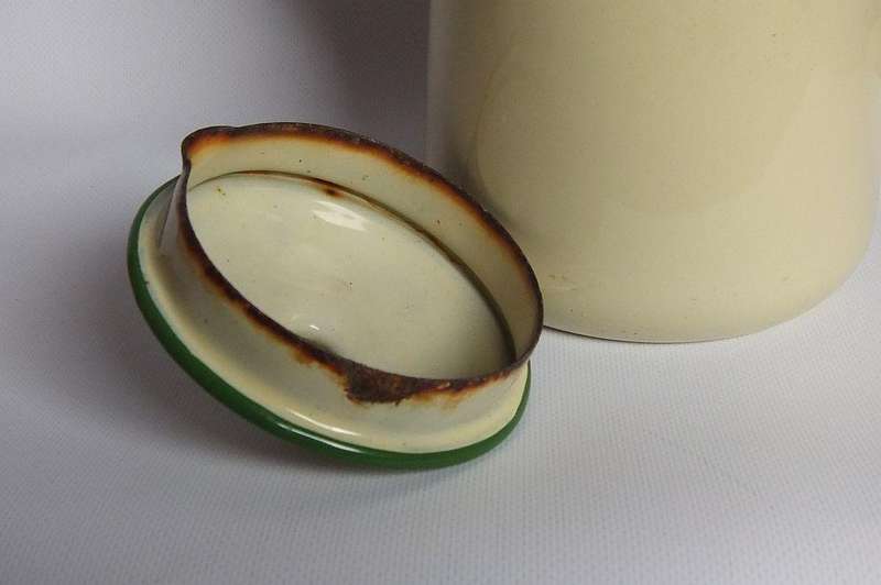 A vintage enamel camping tea or coffee pot