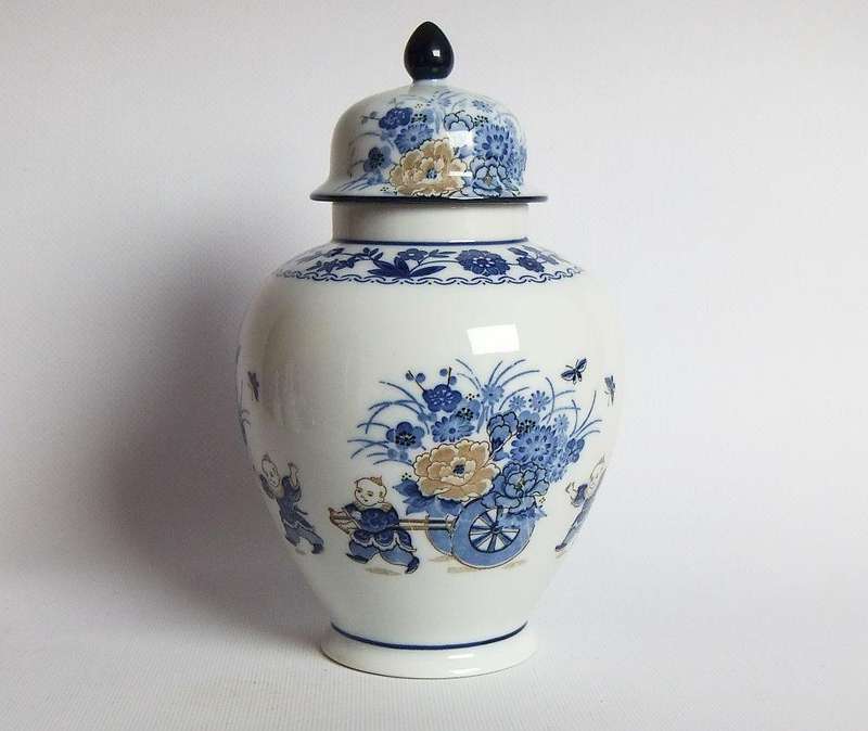 A vintage Japanese Genuine Imperial Imari porcelain lidded jar with child and floral motif